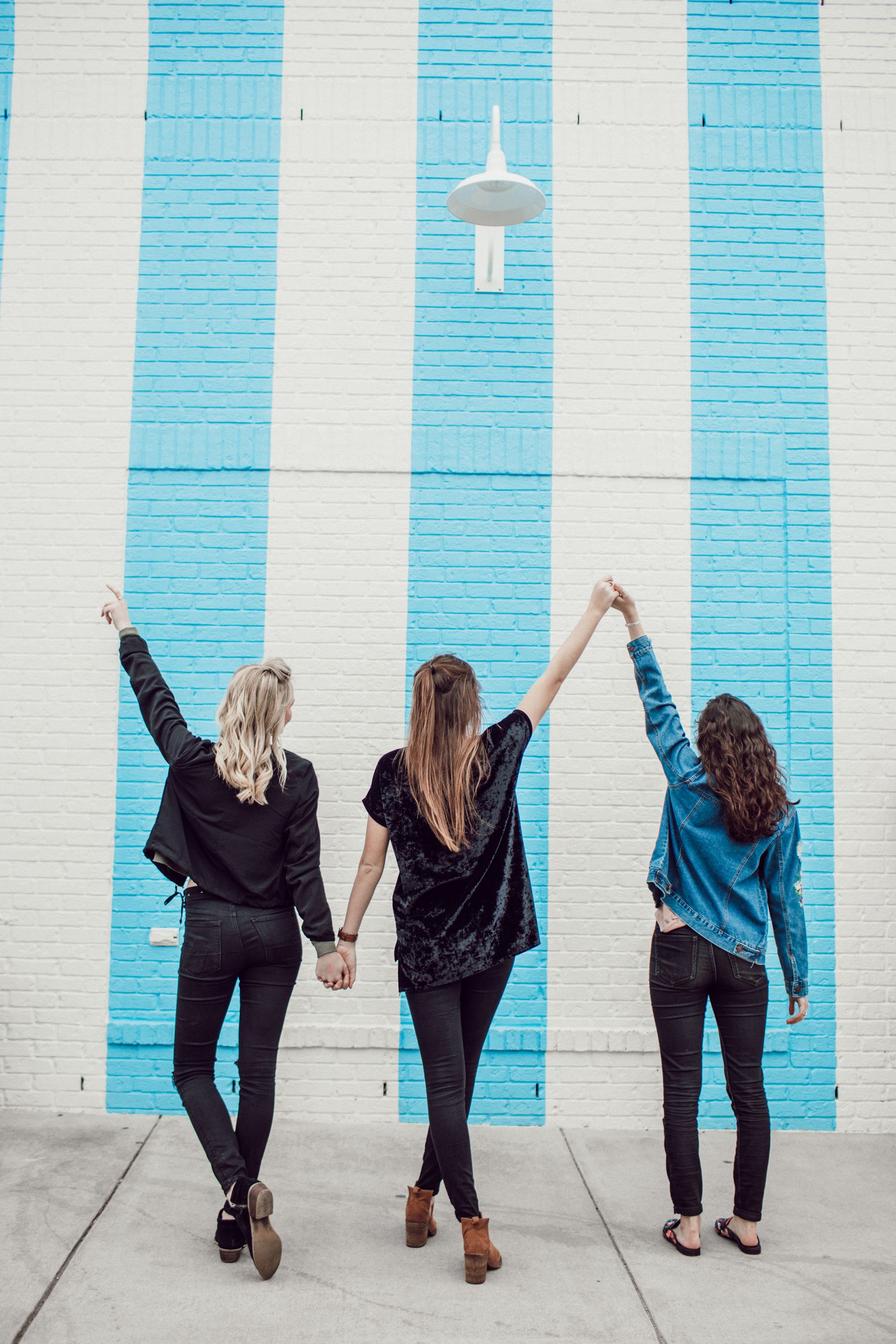 a group of people on a sidewalk